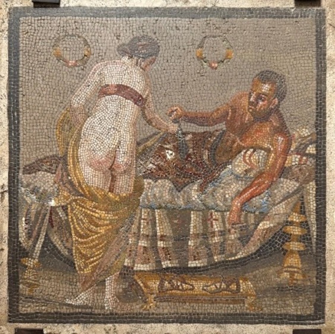 Roman mosaic depicting two half nude lovers