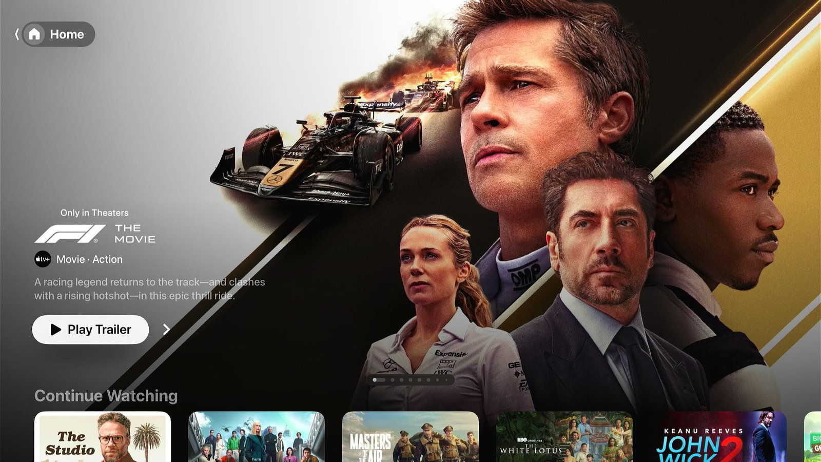 tvOS home screen with an F1 trailer at the top and new Liquid Glass design