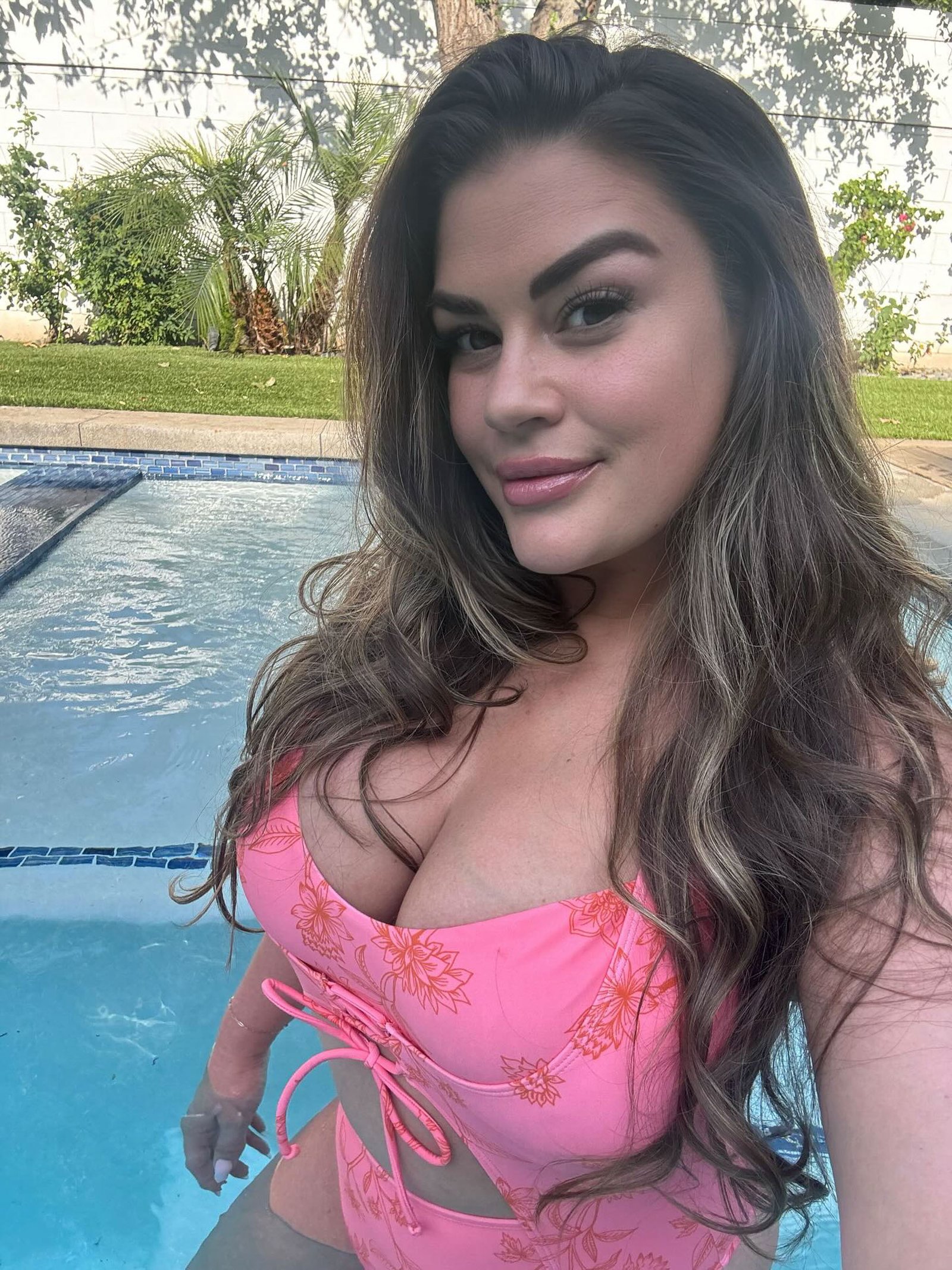 Brittany Cartwright in a hot pink swimsuit selfie. 