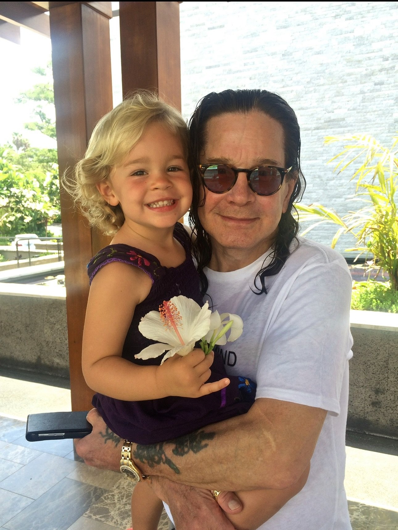 Ozzy Osbourne with a granddaughter. 