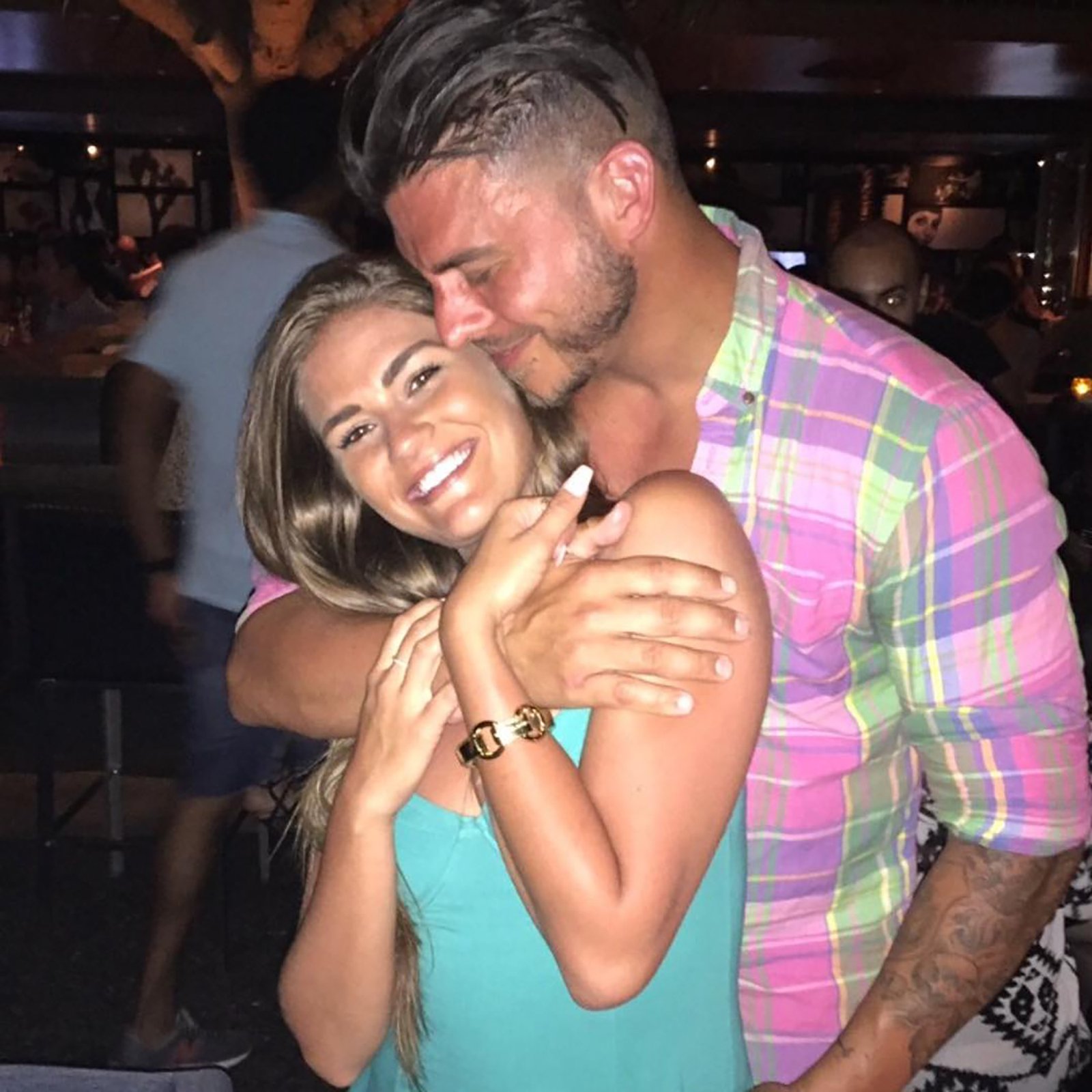 Brittany Cartwright and Jax Taylor hugging. 