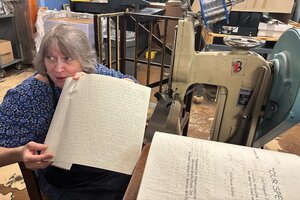 Elizabeth Bouvier binds books together at the National Braille Press in Boston.