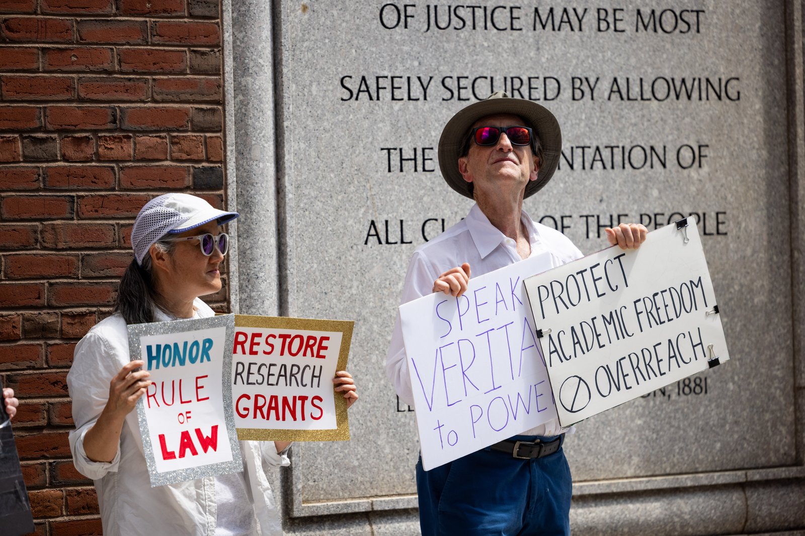 BOSTON, MASSACHUSETTS - JULY 21: Protestors gather outside the John Joseph Moakley United States Courthouse on July 21, 2025 in Boston, Massachusetts. Lawyers for Harvard University argued in federal court on Monday that the federal government's freeze of more than $2 billion in grants and contracts is illegal and should be reversed. (Photo by Scott Eisen/Getty Images)