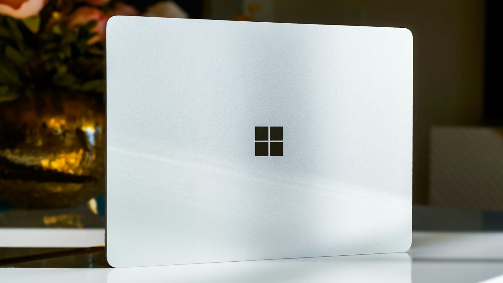 Windows logo on white laptop being stood on its side