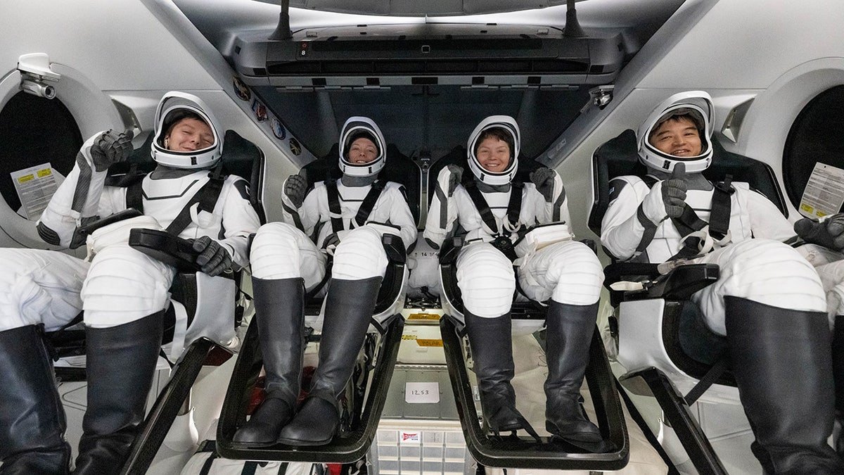 Crew members in capsule after splashdown
