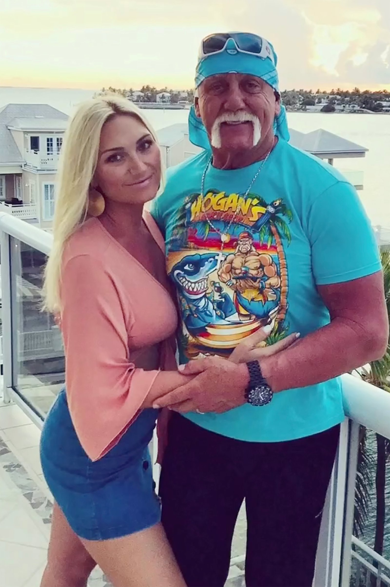 Brooke Hogan and dad Hulk Hogan holding each other.