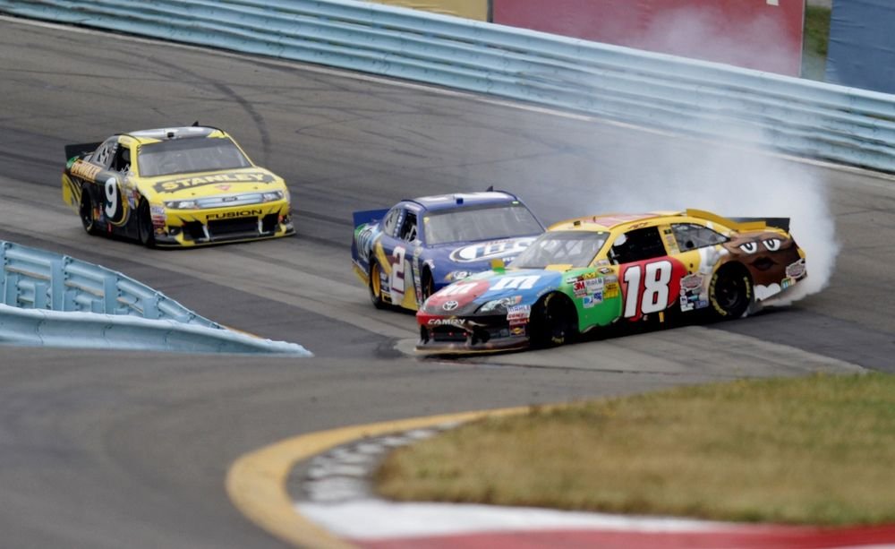 Kyle Busch, Joe Gibbs Racing Toyota; Brad Keselowski, Penske Dodge; Marcos Ambrose, Richard Petty Motorsports Ford